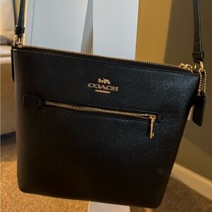 Coach black crossbody purse.
